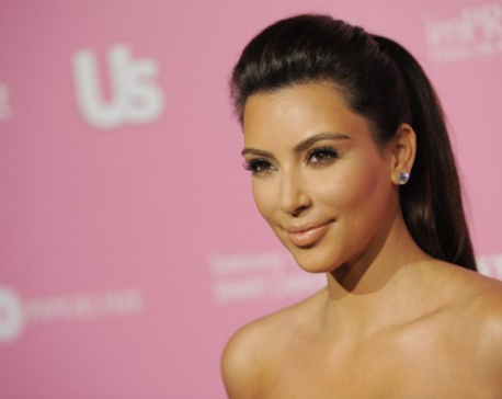 Kim Kardashian exposes again in sheer top